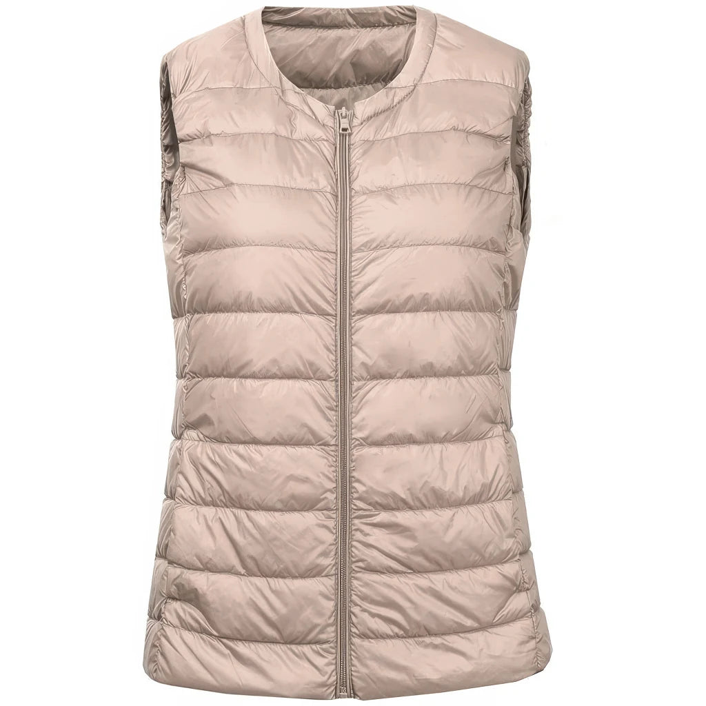 Doudoune sans manche cintrée beige rosé, coupe ajustée et fermeture zippée centrale