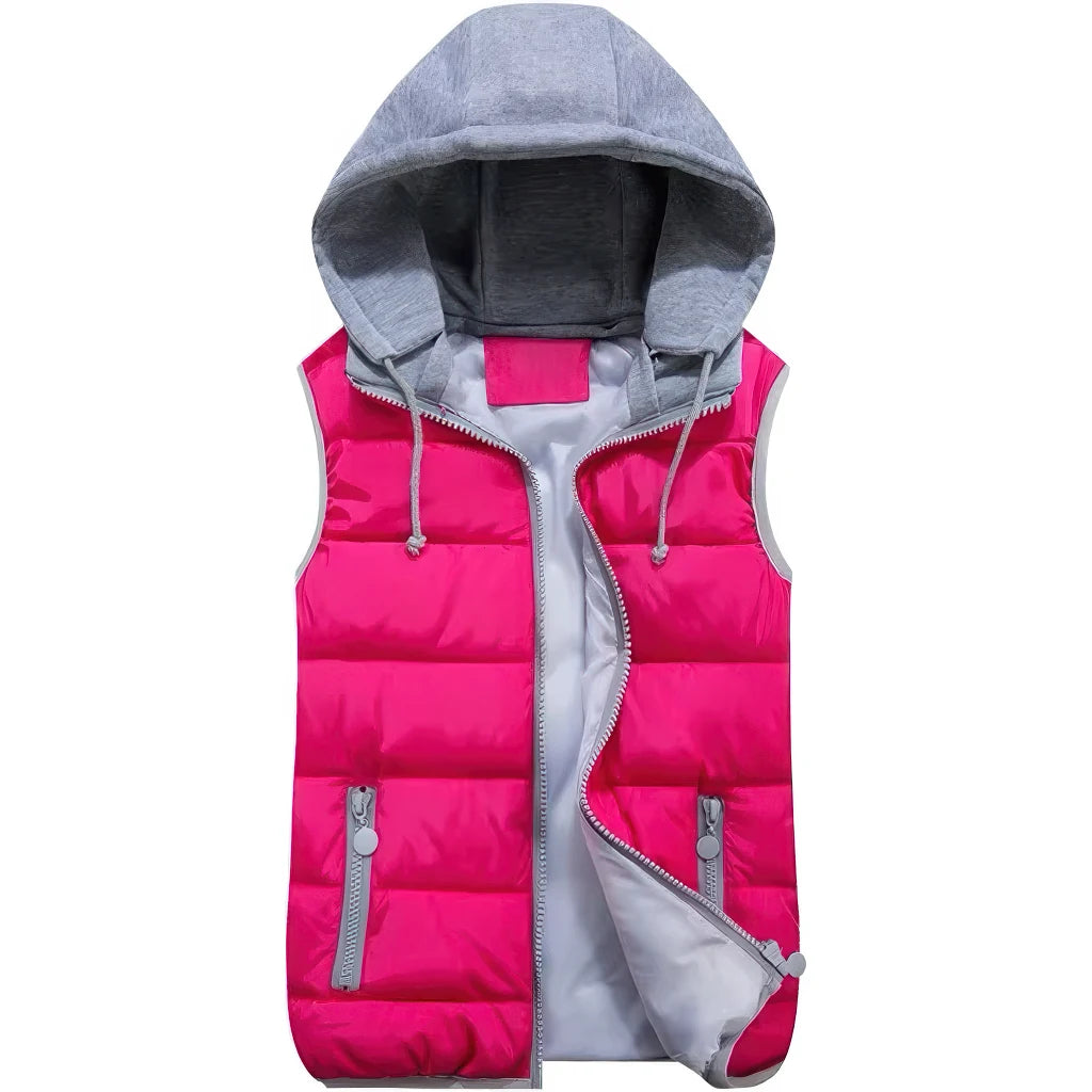 Doudoune sans manche femme ski rose fuchsia de face, capuche en molleton gris et zip ouvert